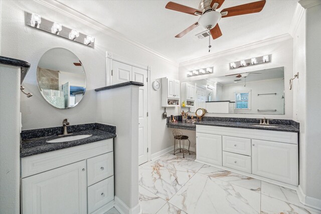 7506 Dearborn St, Houston, TX 77055 - bathroom with a ceiling fan, marble look tile flooring, ornamental molding, two vanities, and baseboards