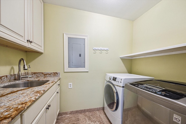 7506 Dearborn St, Houston, TX 77055 - laundry room with electric panel, washer and clothes dryer, cabinet space, and baseboards
