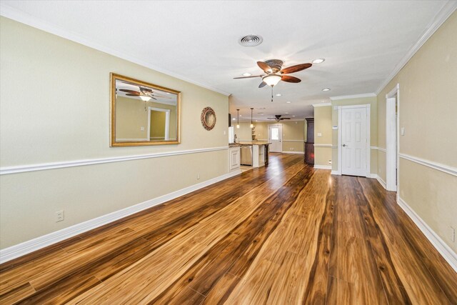 7506 Dearborn St, Houston, TX 77055 - unfurnished living room featuring a ceiling fan, ornamental molding, dark wood finished floors, recessed lighting, and baseboards
