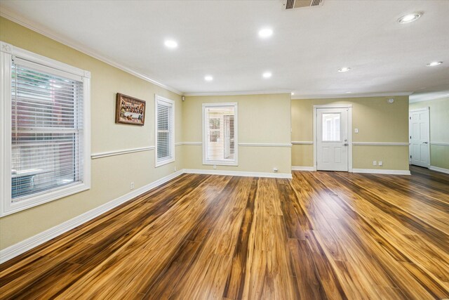 7506 Dearborn St, Houston, TX 77055 - spare room with ornamental molding, baseboards, wood finished floors, and recessed lighting