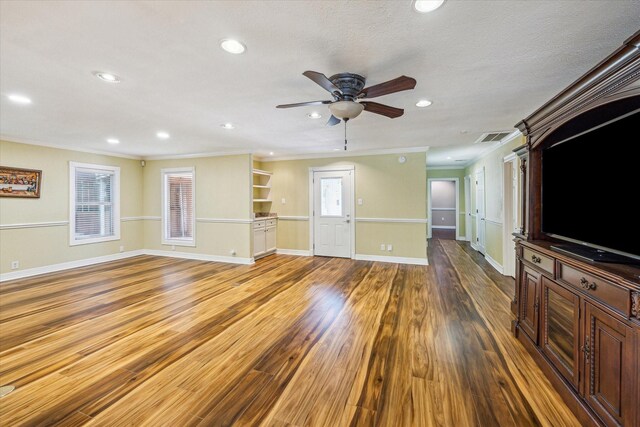 7506 Dearborn St, Houston, TX 77055 - unfurnished living room with crown molding, ceiling fan, baseboards, wood finished floors, and recessed lighting