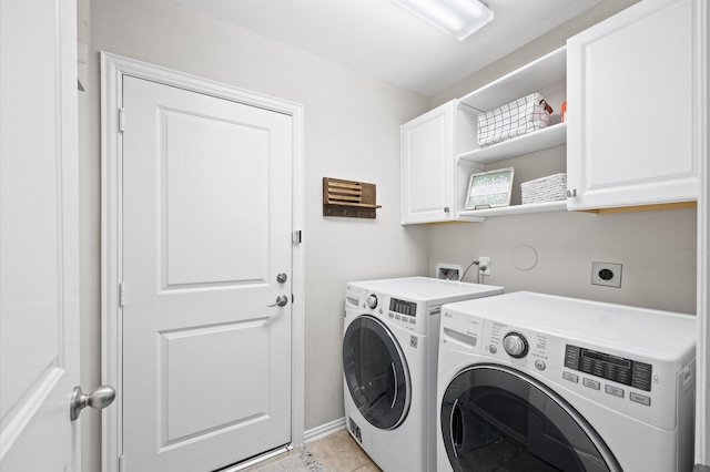 2807 Hadley Spgs, Spring, TX 77386 - laundry room with cabinet space, washer and dryer, light tile patterned flooring, and baseboards