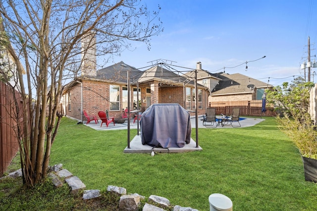 2807 Hadley Spgs, Spring, TX 77386 - rear view of house featuring a gazebo, a patio, brick siding, and a fire pit