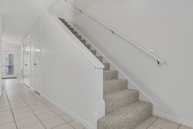 2521 Crosstimbers St Unit A3, Huntsville, TX 77320 - stairs featuring tile patterned floors and baseboards