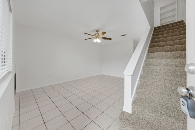 2521 Crosstimbers St Unit A3, Huntsville, TX 77320 - stairway featuring ceiling fan and tile patterned floors