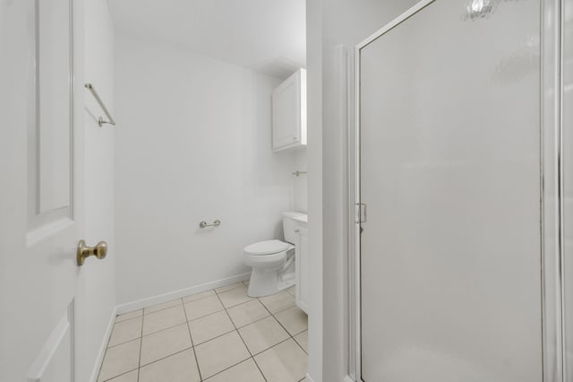 2521 Crosstimbers St Unit A3, Huntsville, TX 77320 - bathroom featuring tile patterned floors, a stall shower, toilet, and baseboards