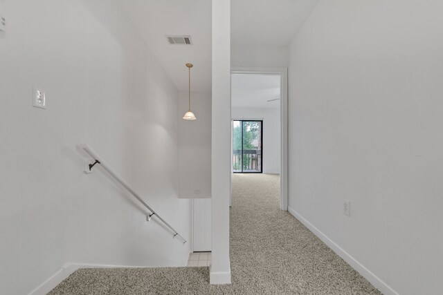 2521 Crosstimbers St Unit A3, Huntsville, TX 77320 - stairway featuring carpet and baseboards