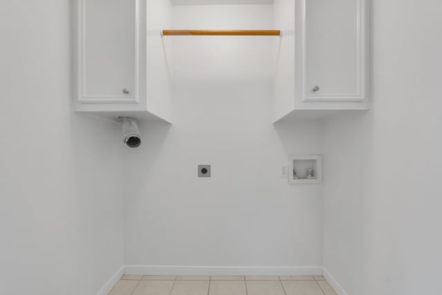 2521 Crosstimbers St Unit A3, Huntsville, TX 77320 - laundry room featuring electric dryer hookup, washer hookup, baseboards, and cabinet space