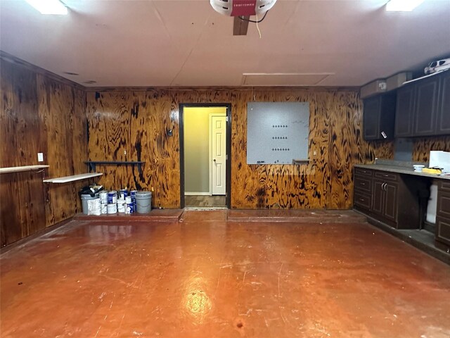 243 Fantasy Ln, Montgomery, TX 77356 - garage with wood walls and a garage door opener
