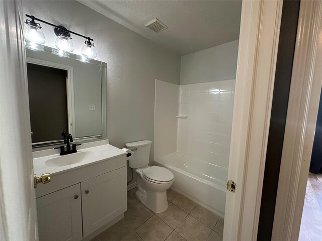 243 Fantasy Ln, Montgomery, TX 77356 - bathroom with vanity, toilet, tile patterned flooring, and washtub / shower combination