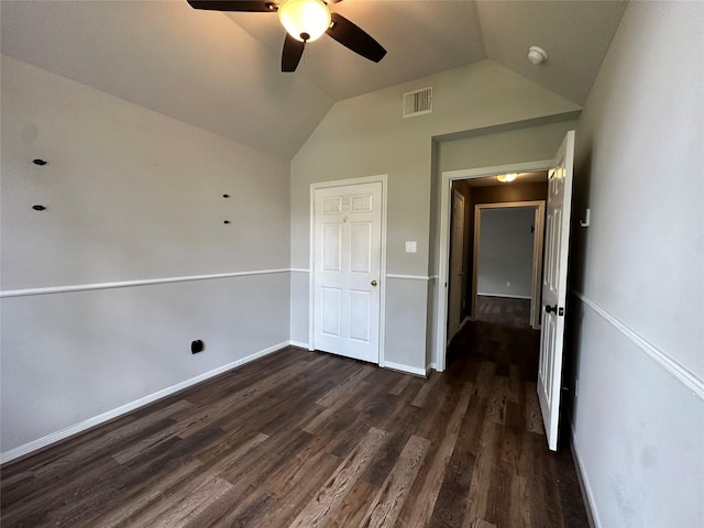 243 Fantasy Ln, Montgomery, TX 77356 - unfurnished bedroom with vaulted ceiling, dark wood-type flooring, baseboards, and ceiling fan
