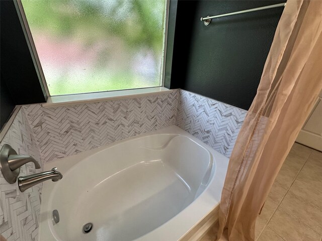243 Fantasy Ln, Montgomery, TX 77356 - full bathroom with a bath and tile patterned floors