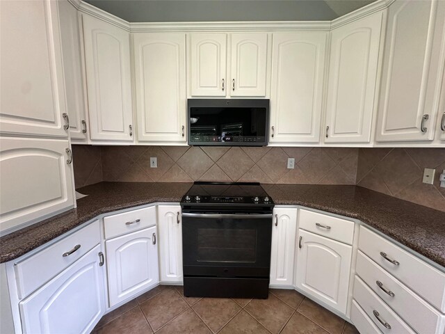 243 Fantasy Ln, Montgomery, TX 77356 - kitchen featuring black range with electric cooktop, tile patterned flooring, decorative backsplash, and white cabinetry