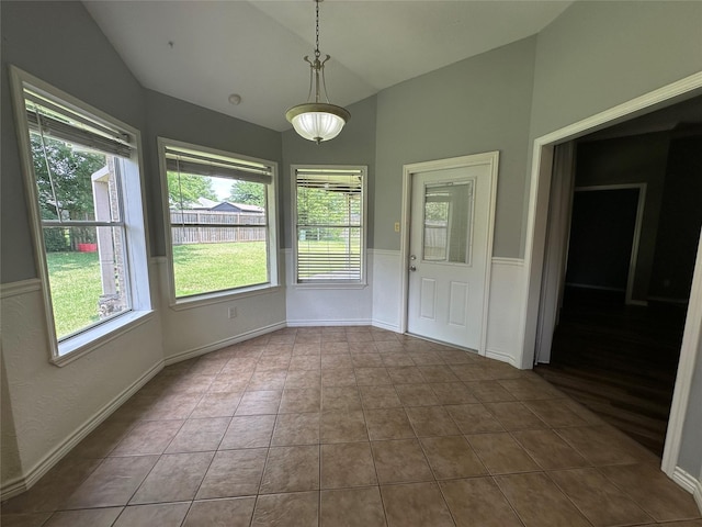 243 Fantasy Ln, Montgomery, TX 77356 - unfurnished dining area with vaulted ceiling and tile patterned floors