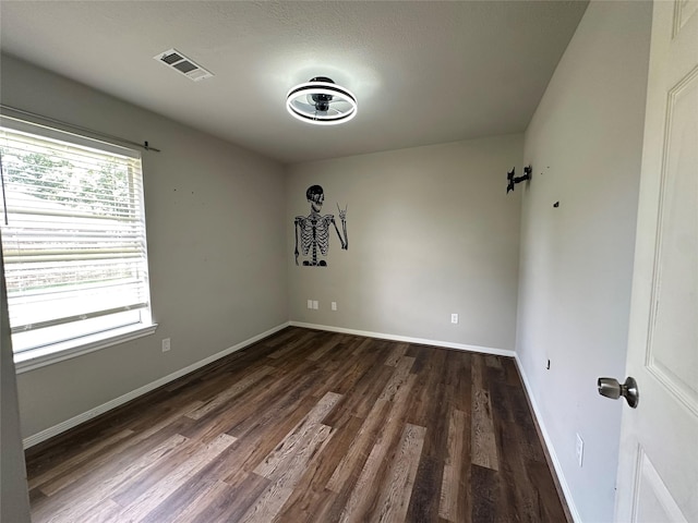 243 Fantasy Ln, Montgomery, TX 77356 - unfurnished room featuring dark wood finished floors and baseboards