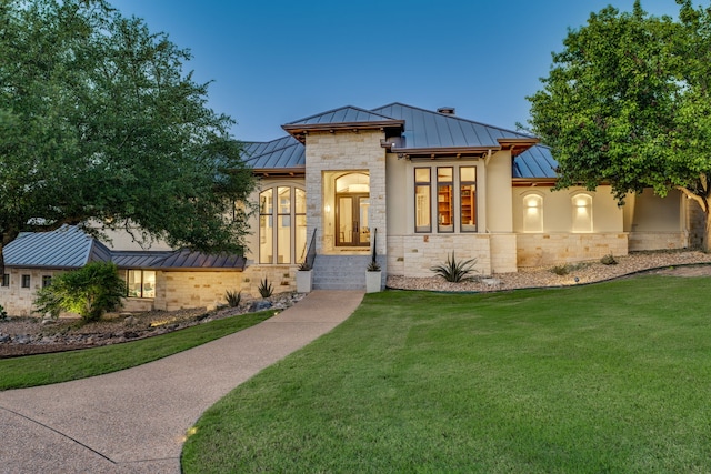 115 Hidden Hills Dr, Spicewood, TX 78669 - view of front of home featuring a standing seam roof, metal roof, and a front yard