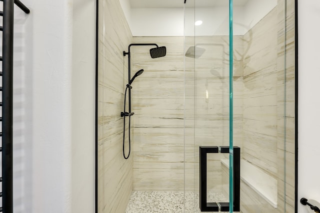 115 Hidden Hills Dr, Spicewood, TX 78669 - full bathroom featuring a shower stall and speckle patterned floor