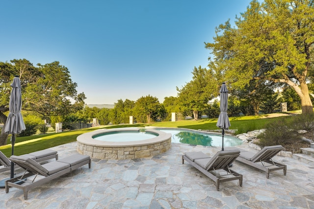 115 Hidden Hills Dr, Spicewood, TX 78669 - view of patio with an in-ground hot tub and an outdoor pool