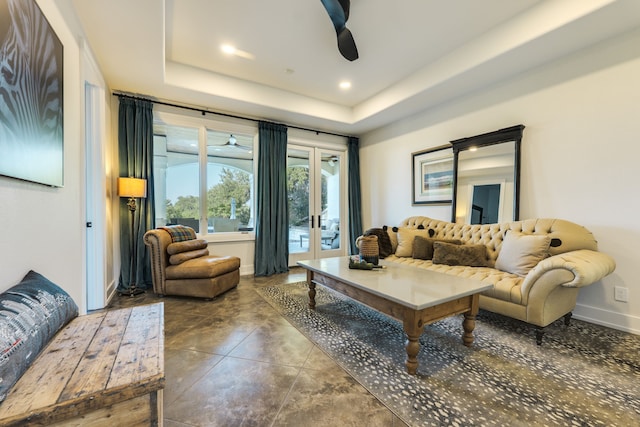 115 Hidden Hills Dr, Spicewood, TX 78669 - living area with a ceiling fan, french doors, baseboards, a tray ceiling, and concrete flooring