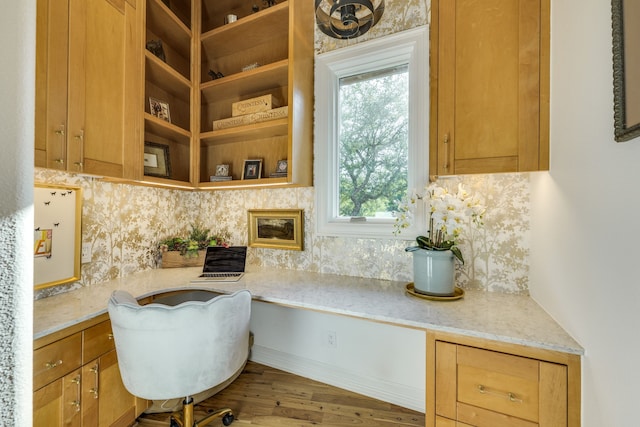 115 Hidden Hills Dr, Spicewood, TX 78669 - kitchen with plenty of natural light, backsplash, wood finished floors, and light stone counters
