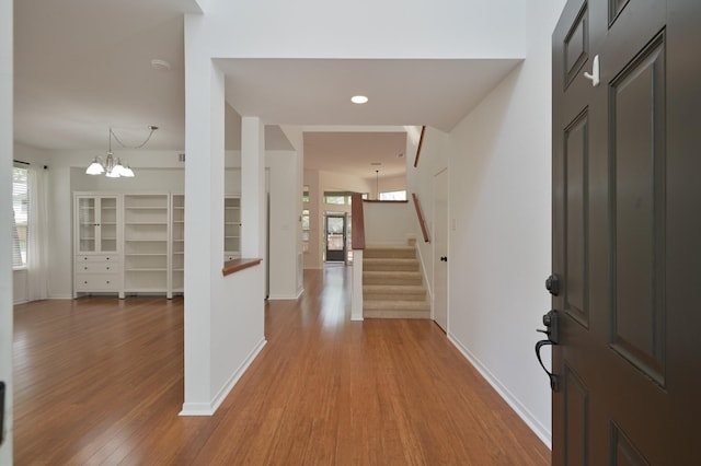 3 Shallow Pond Ct, The Woodlands, TX 77381 - foyer entrance featuring wood finished floors, a chandelier, baseboards, stairway, and recessed lighting