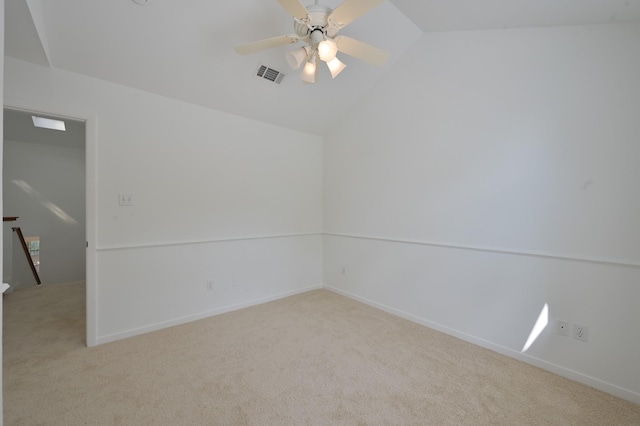 3 Shallow Pond Ct, The Woodlands, TX 77381 - spare room with light carpet, vaulted ceiling, a ceiling fan, and baseboards