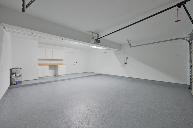 3 Shallow Pond Ct, The Woodlands, TX 77381 - garage with a garage door opener