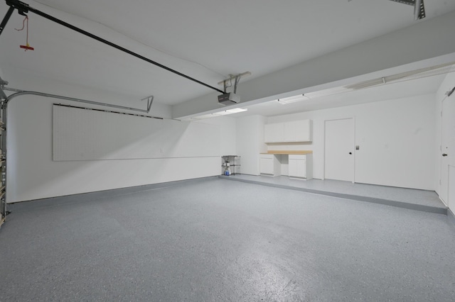 3 Shallow Pond Ct, The Woodlands, TX 77381 - garage featuring a garage door opener