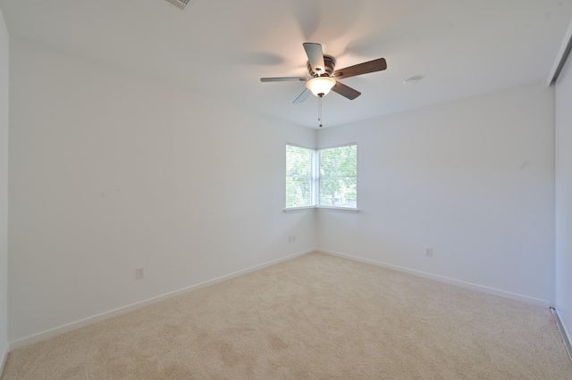 3 Shallow Pond Ct, The Woodlands, TX 77381 - spare room featuring light colored carpet, a ceiling fan, and baseboards