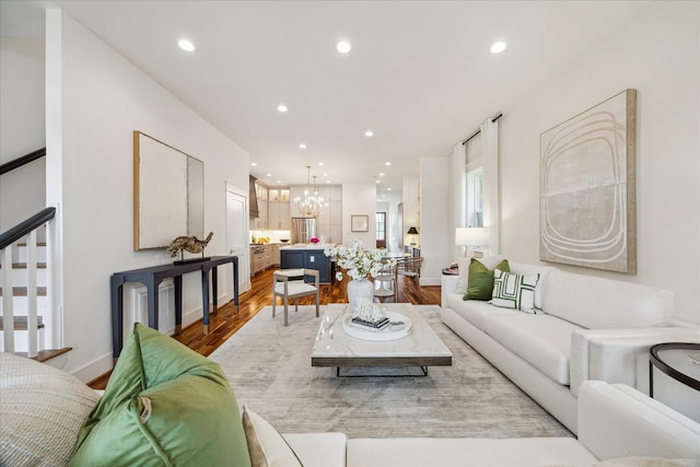 1518 31st St, Galveston, TX 77550 - living room with a chandelier, wood finished floors, recessed lighting, stairs, and baseboards