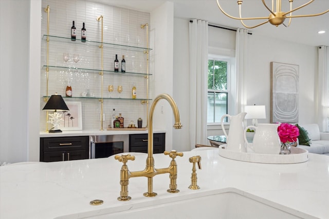 1518 31st St, Galveston, TX 77550 - indoor bar with wine cooler, decorative backsplash, and a chandelier