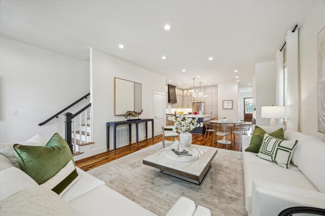 1518 31st St, Galveston, TX 77550 - living area with wood finished floors, stairway, a chandelier, and recessed lighting