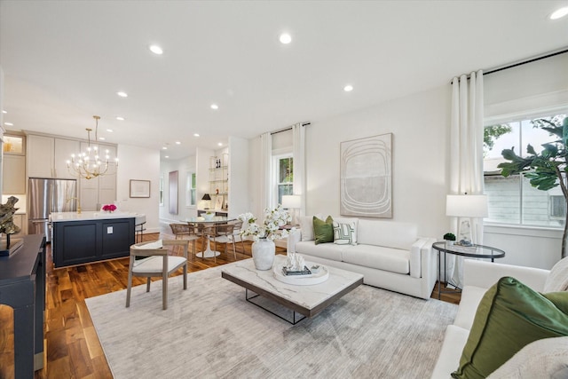 1518 31st St, Galveston, TX 77550 - living room featuring healthy amount of natural light, a chandelier, recessed lighting, and wood finished floors