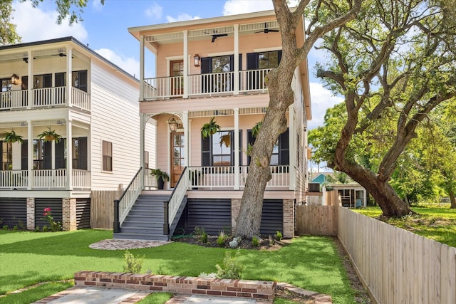 1518 31st St, Galveston, TX 77550 - view of front of house with a balcony, ceiling fan, stairs, and a porch