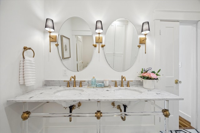 1518 31st St, Galveston, TX 77550 - bathroom featuring double vanity and wood finished floors
