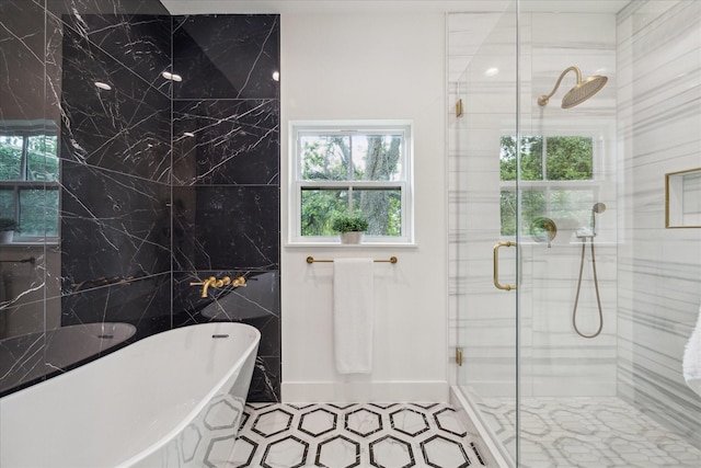 1518 31st St, Galveston, TX 77550 - full bath featuring a freestanding tub, a stall shower, tile walls, and plenty of natural light