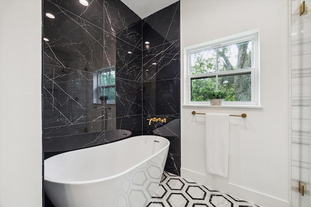 1518 31st St, Galveston, TX 77550 - bathroom featuring a freestanding bath and tile walls