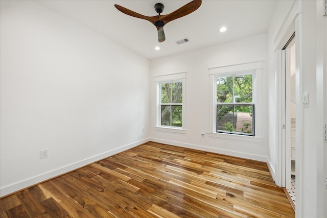 1518 31st St, Galveston, TX 77550 - spare room featuring wood finished floors, a ceiling fan, baseboards, and recessed lighting