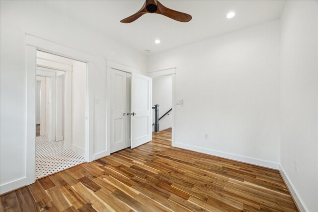 1518 31st St, Galveston, TX 77550 - unfurnished bedroom with wood finished floors, recessed lighting, baseboards, and ceiling fan