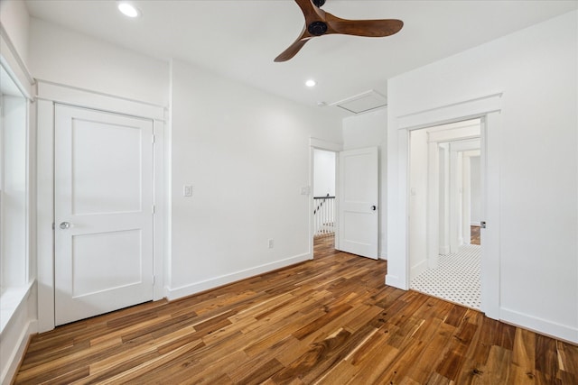 1518 31st St, Galveston, TX 77550 - unfurnished bedroom with wood finished floors, recessed lighting, ceiling fan, and baseboards