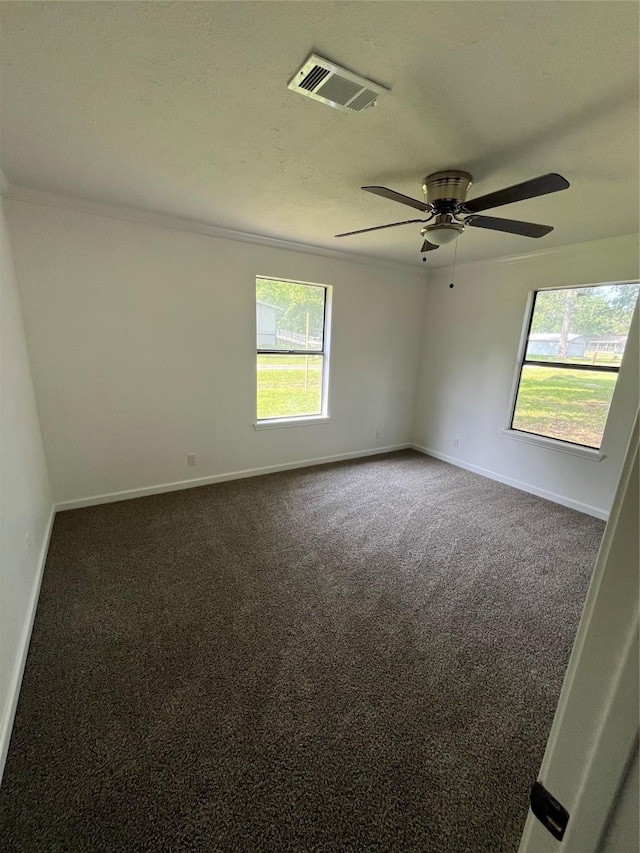169 W Sunset Dr, Trinity, TX 75862 - carpeted empty room featuring baseboards, ceiling fan, and crown molding