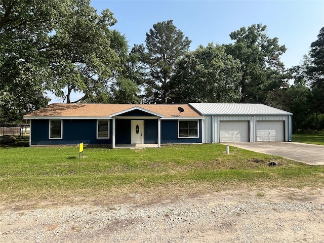 169 W Sunset Dr, Trinity, TX 75862 - single story home with driveway, a front lawn, and an attached garage