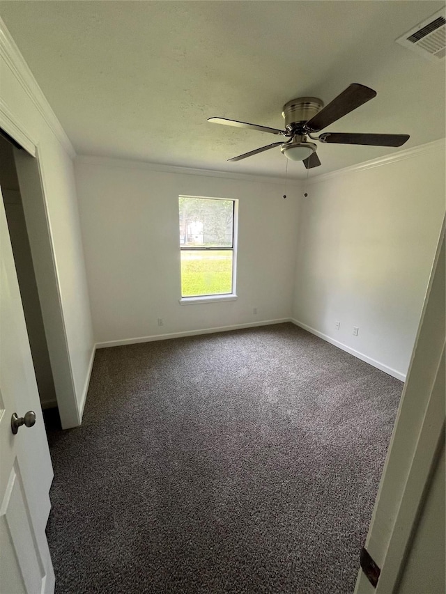 169 W Sunset Dr, Trinity, TX 75862 - empty room with crown molding, dark colored carpet, a ceiling fan, and baseboards