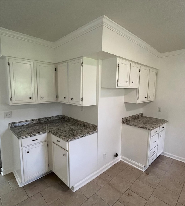 169 W Sunset Dr, Trinity, TX 75862 - kitchen featuring white cabinets, crown molding, baseboards, and tile patterned flooring