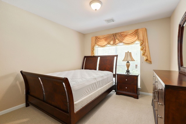 12822 Winding Manor Dr, Houston, TX 77044 - bedroom featuring light colored carpet and baseboards