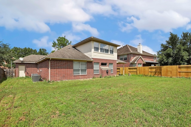 12822 Winding Manor Dr, Houston, TX 77044 - back of house featuring brick siding, central air condition unit, and roof with shingles