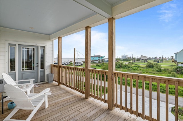 1023 N Bay St, Gilchrist, TX 77617 - wooden deck featuring a residential view