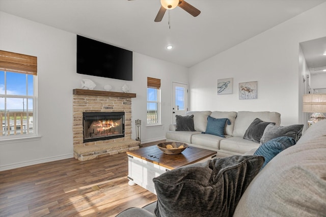 1023 N Bay St, Gilchrist, TX 77617 - living room featuring plenty of natural light, ceiling fan, lofted ceiling, baseboards, and wood finished floors