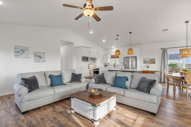 1023 N Bay St, Gilchrist, TX 77617 - living room featuring ceiling fan, wood finished floors, recessed lighting, and high vaulted ceiling