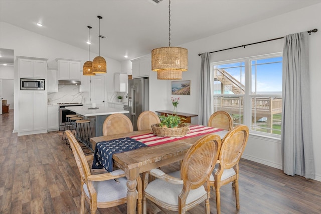 1023 N Bay St, Gilchrist, TX 77617 - dining space featuring lofted ceiling, wood finished floors, recessed lighting, and baseboards